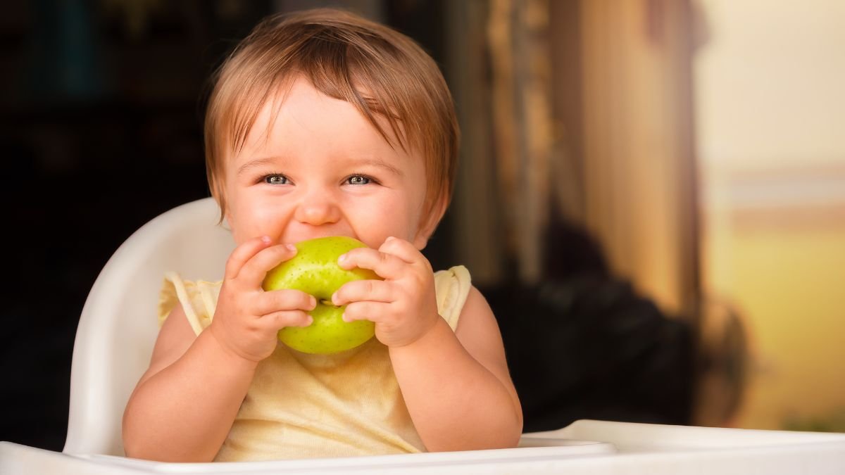 A Boy eating an apple