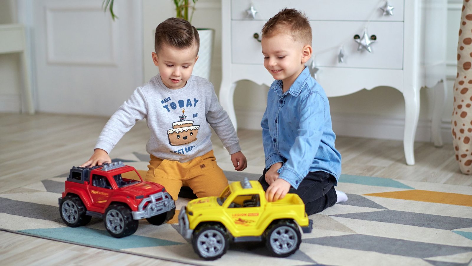 Two Boys Playing with Toy Car